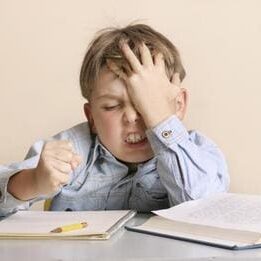 Young boy frustrated with homework