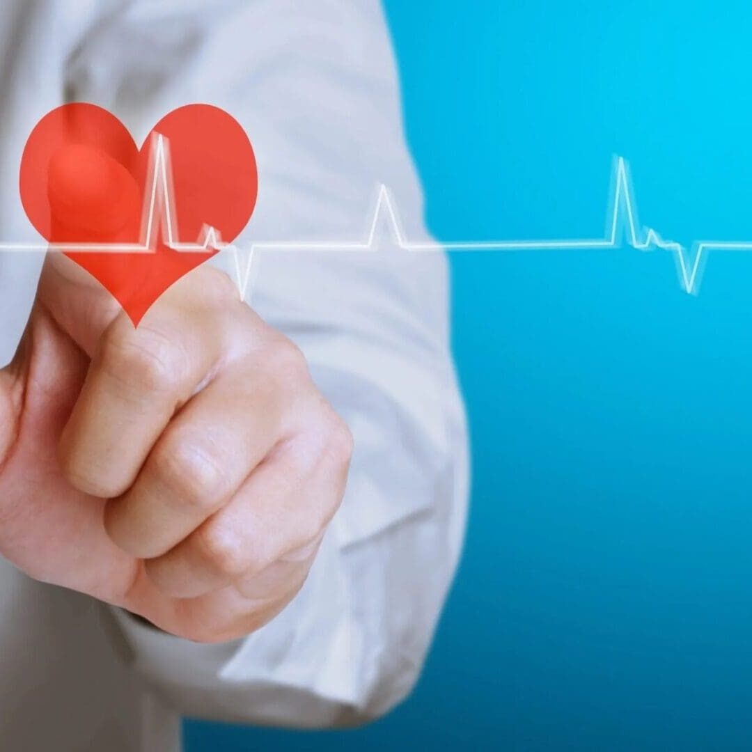 Hand pointing at heart with ECG line